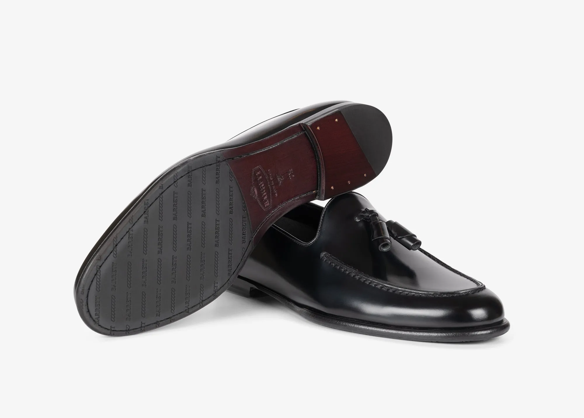 Mocassino con nappine in pelle spazzolata nera
